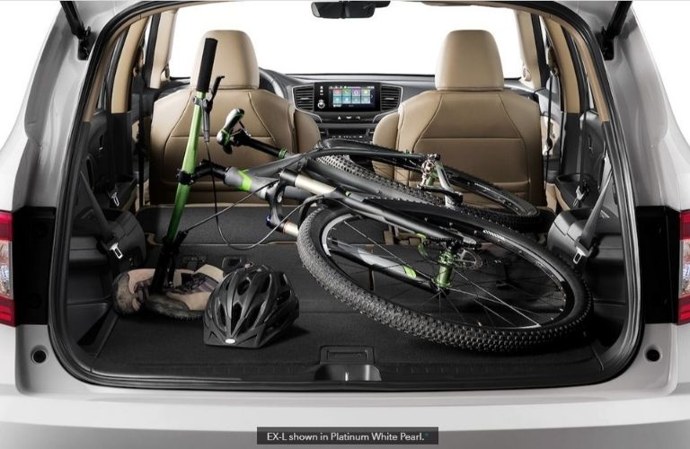 Image showing a bike and other gear stored inside a 2022 Honda Pilot