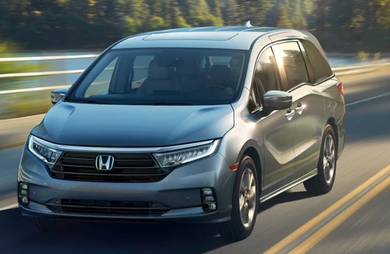 2023 Honda Odyssey Gray driving on the road