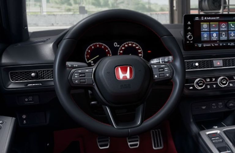 An image of the Honda leather-wrapped steering wheel of the 2023 Honda Civic Type R.