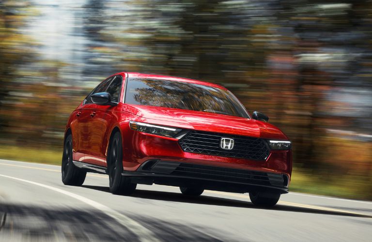 2023 Honda Accord in red exterior paint on the road