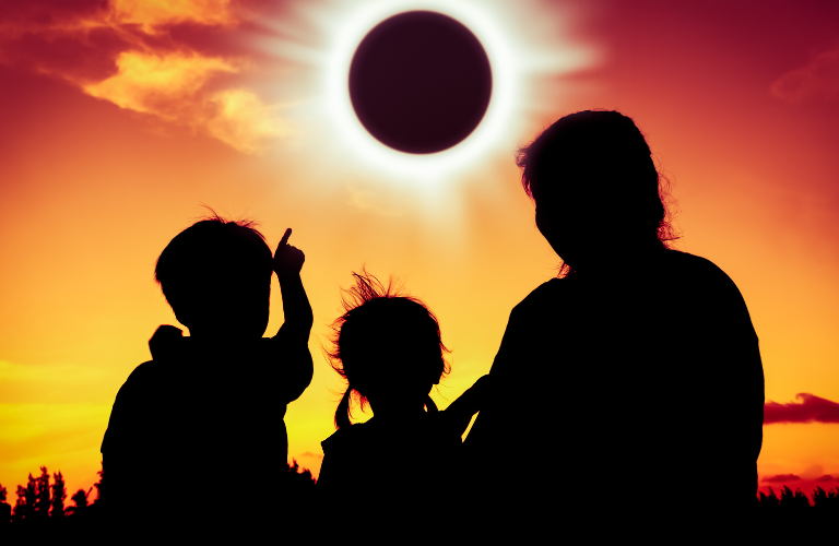 A family watching the solar eclipse