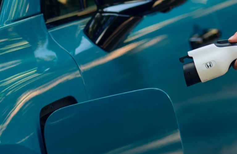 close up of 2025 Honda Prologue getting charged